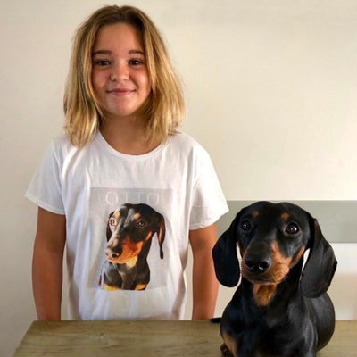 Happy little girl with her custom t-shirt of her pretty sausage dog