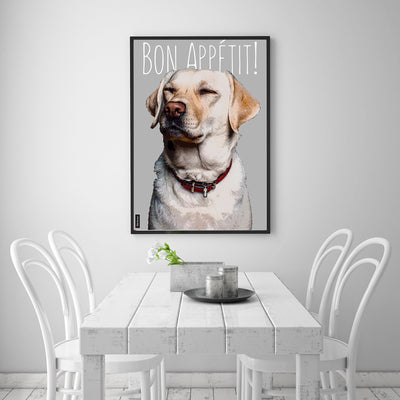 Custom pet portrait of Labrador retriever in a black frame displayed in a white dining room