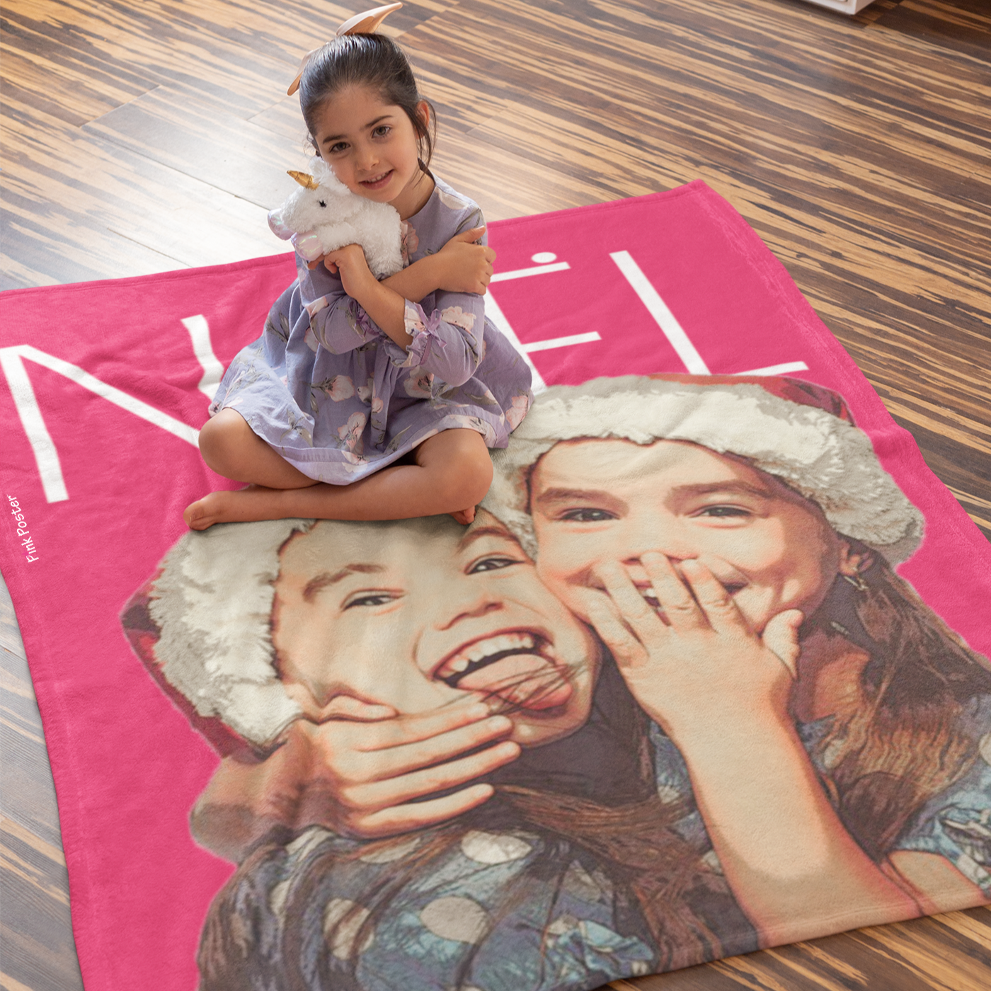 little girl sitting on her own custom blanket